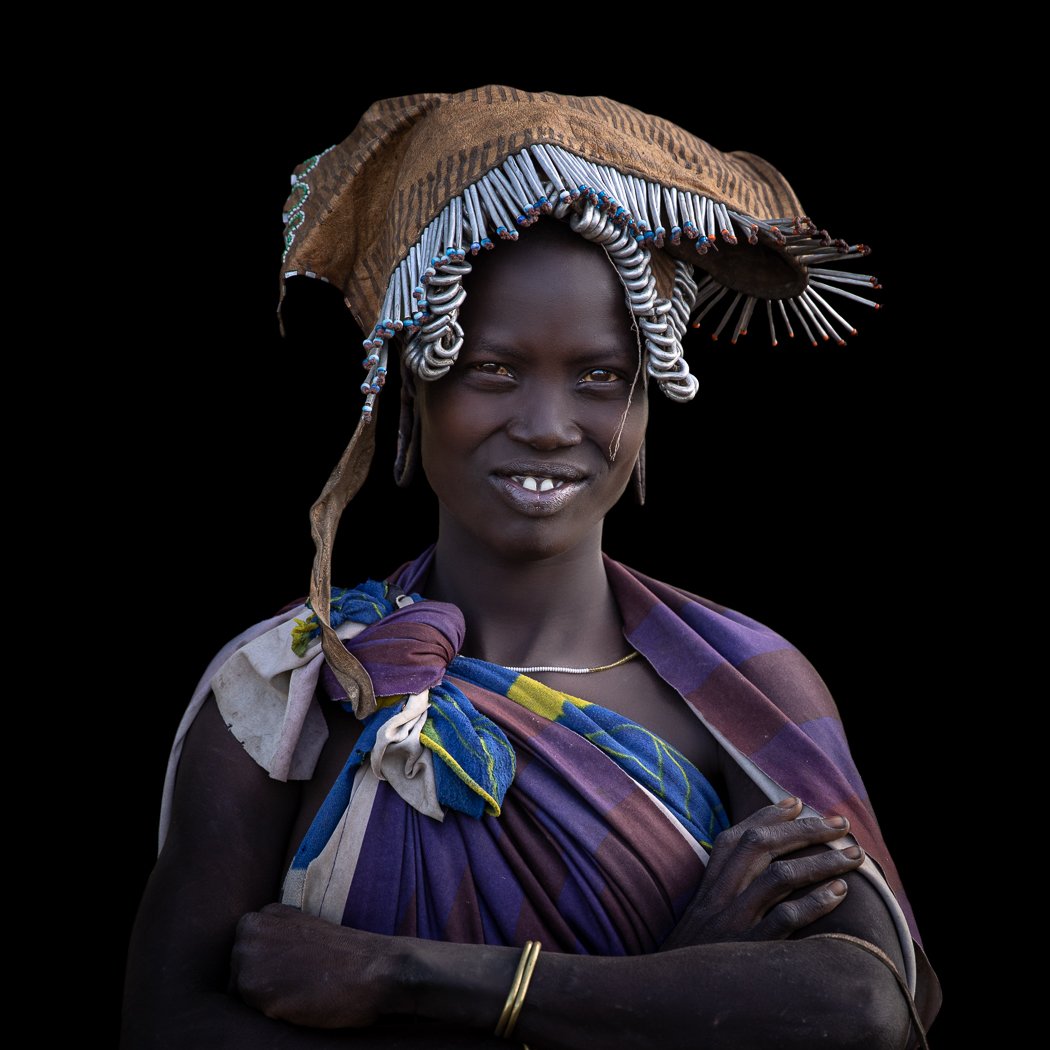 Mursi tribe beautiful woman Omo Valley tribal portrait on photo tour