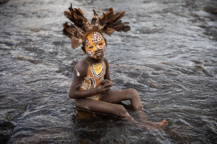 suri_tribe_ethiopia_omo_valley_boy_in_river.jpg
