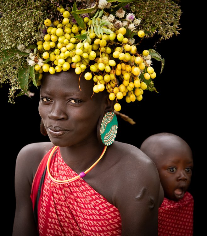 African_suri_tribe_flowers_on_head_portraits_ethiopia-6.jpg