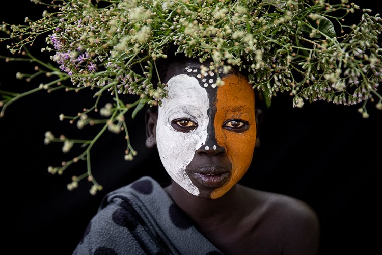 African_suri_tribe_flowers_on_head_portraits_ethiopia-13.jpg