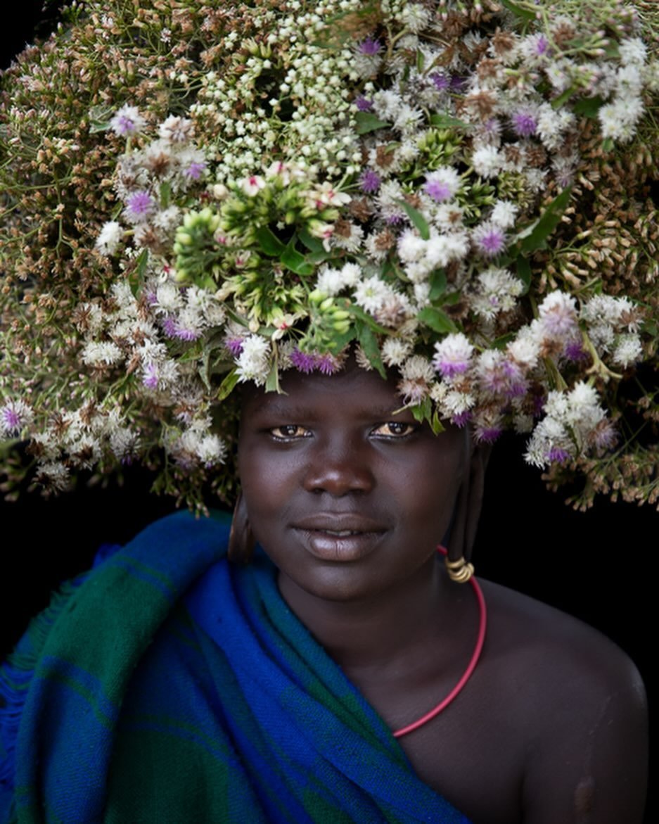 The Suri women have amazing creativity with limited natural resources.  They amaze me with their happiness, mischievousness, strength, resilience and also balance! There&rsquo;s no chance I could balance this many flowers on my head&hellip;AND&hellip