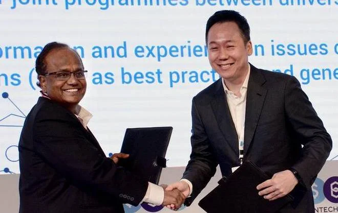 Synergy:Special Chief Secretary and IT Adviser J.A. Chowdary and founder-chairman of Marvelstone Group Joe Cho after signing the MoU at the FinTech Spring Conference in Visakhapatnam on Thursday.C.V. SubrahmanyamC.V.Subrahmanyam 