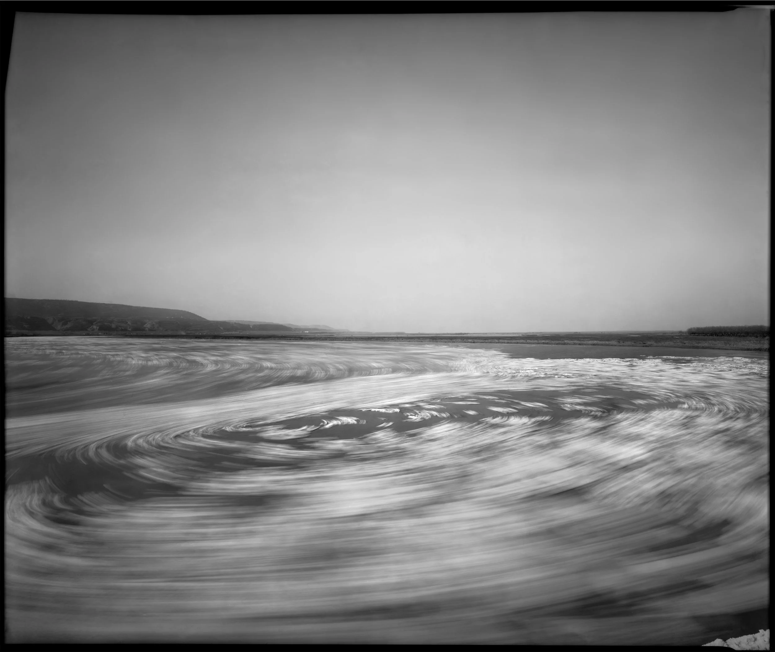 Lin Ran For the last decade, Lin Ran has led a reclusive existence outside of Cheng-du. While ascetic scholars of the past may have chosen brush and ink, Lin chooses large format photographs. Lin’s multi-photograph works are not simple panoramic landscapes. When he goes to shoot a location, he photographs an area from all perspectives, then assembles the prints to create a landscape that appears panoramic, but might actually be two different localities, or the same place from two different angles. Lin has also experimented with platinotypes and cyanotypes.