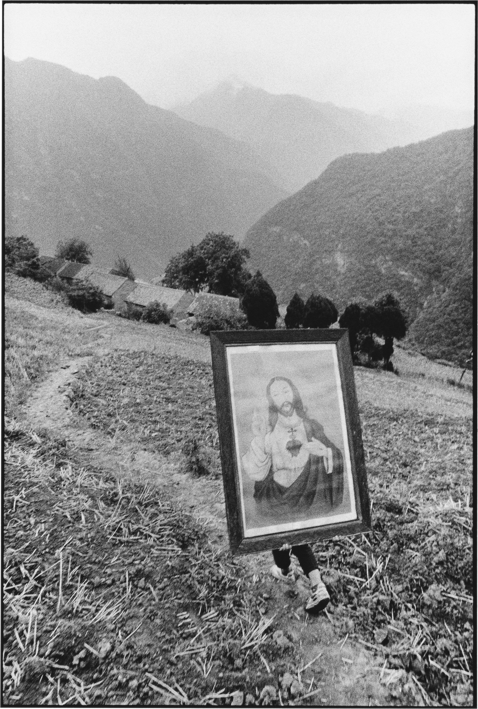 A Youth Carrying an Image of Jesus, Shaanxi, China