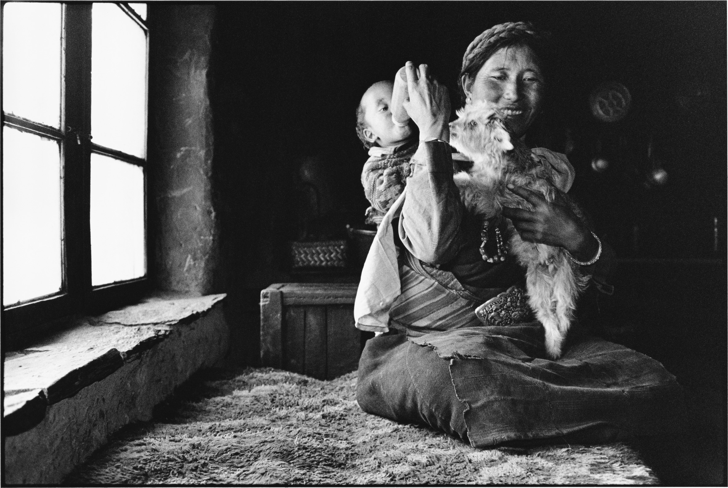 A Woman Feeds Her Baby and a Lamb, Tibet