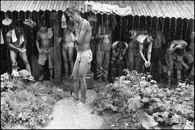 Prisoners Bathing in the Rain and Collecting Rain Water