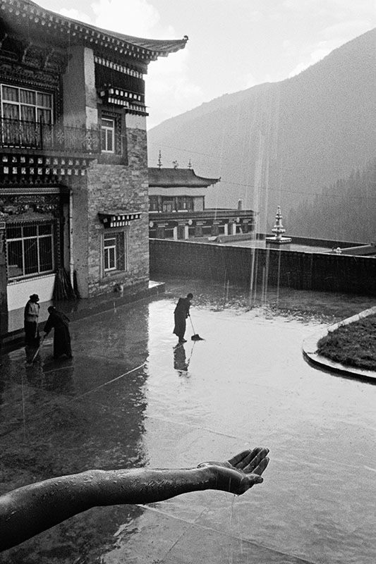 A monk collecting rain water, Sichuan