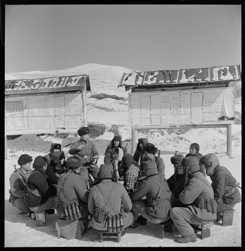 Despite the cold, PLA soldiers continue to study revolutionary theory.