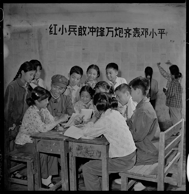 PLA soldiers tutor students in revolutionary theory.