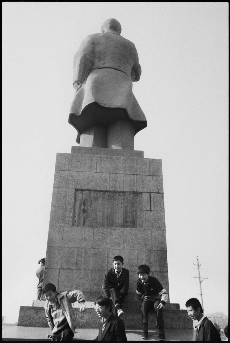 Kids Playing by the Statue