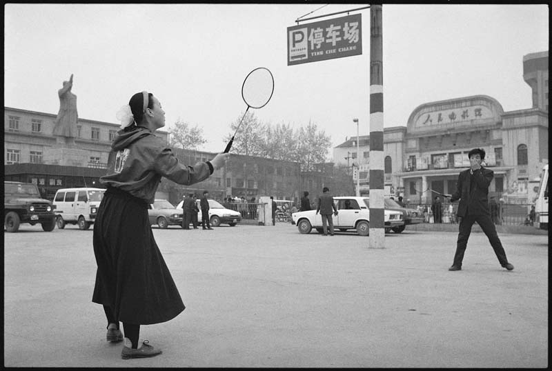 Young Men Playing Badminton