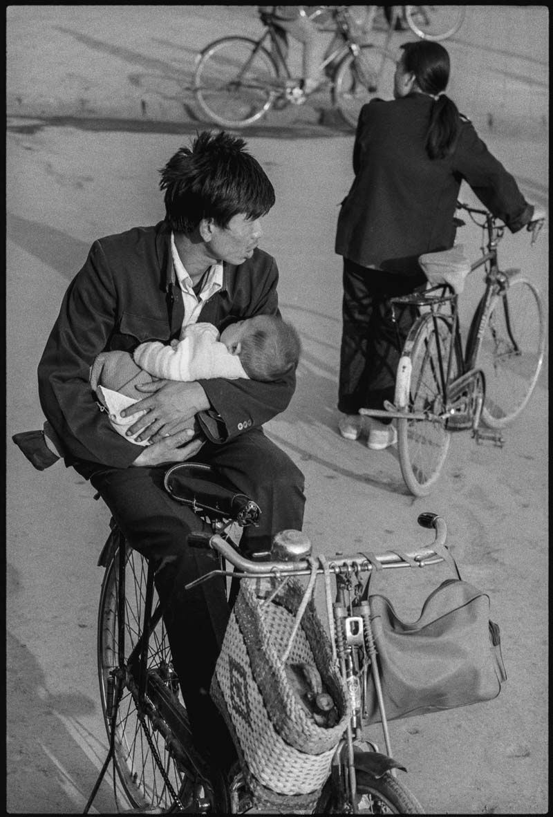 A Nurturing Father on a Bike