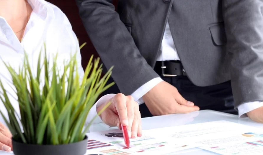 business-colleagues-working-together-and-analyzing-financial-figures-picture-id477863834.jpg