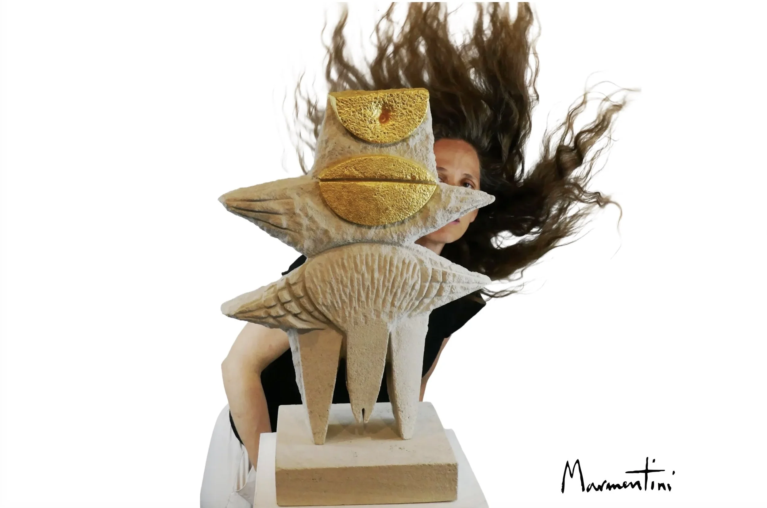 Rhea Marmentini Behind her Sculpture