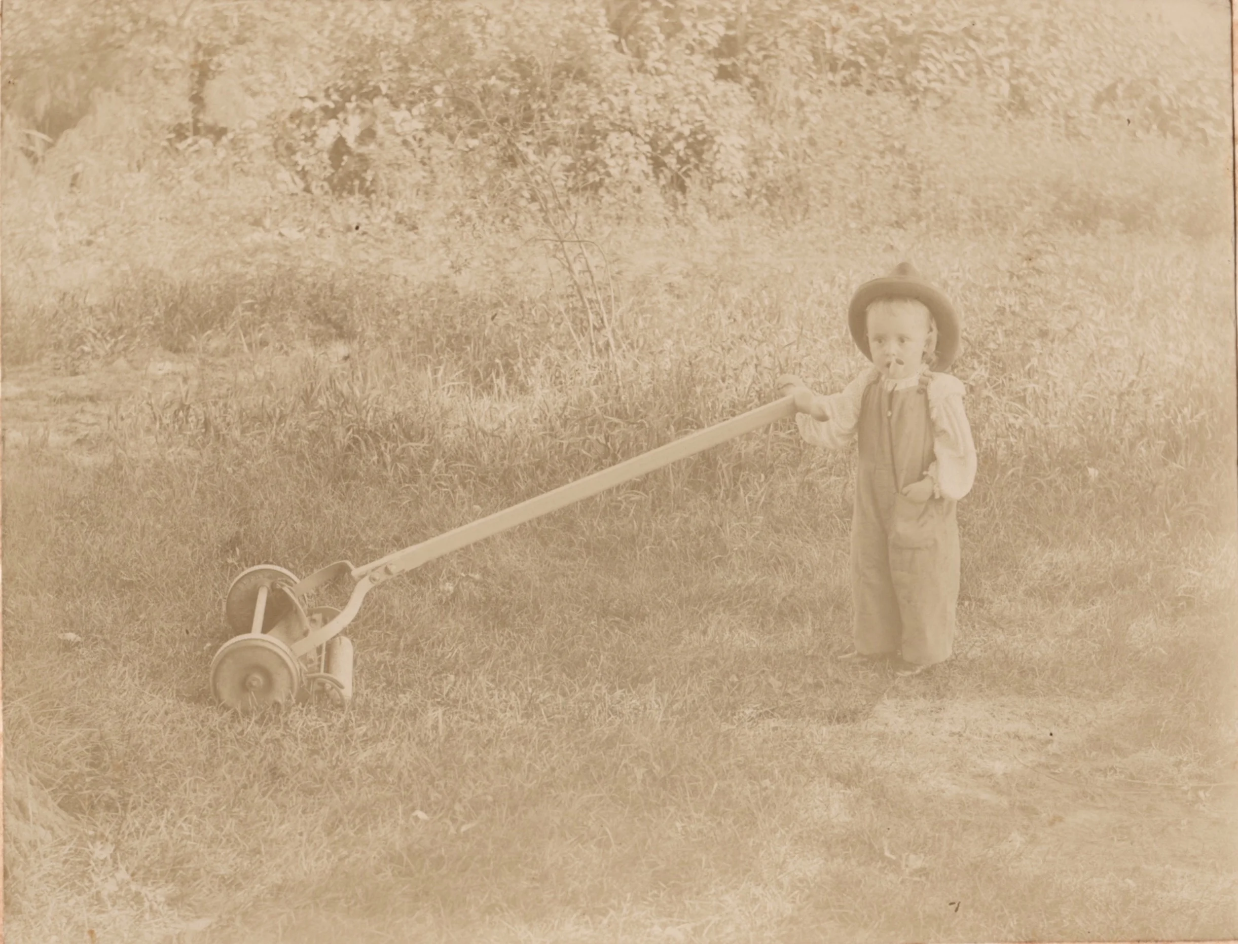 The Psychogenealogist Pic of the Week (#73) - Toddler Smokes Pipe, Mows Lawn