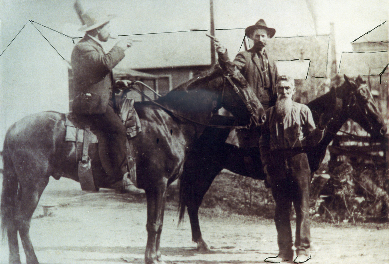 Ozeme Roy is said to be the man on the horse on the left and Wade on the horse on the right. The man standing is identified as Antoine Arnaud.