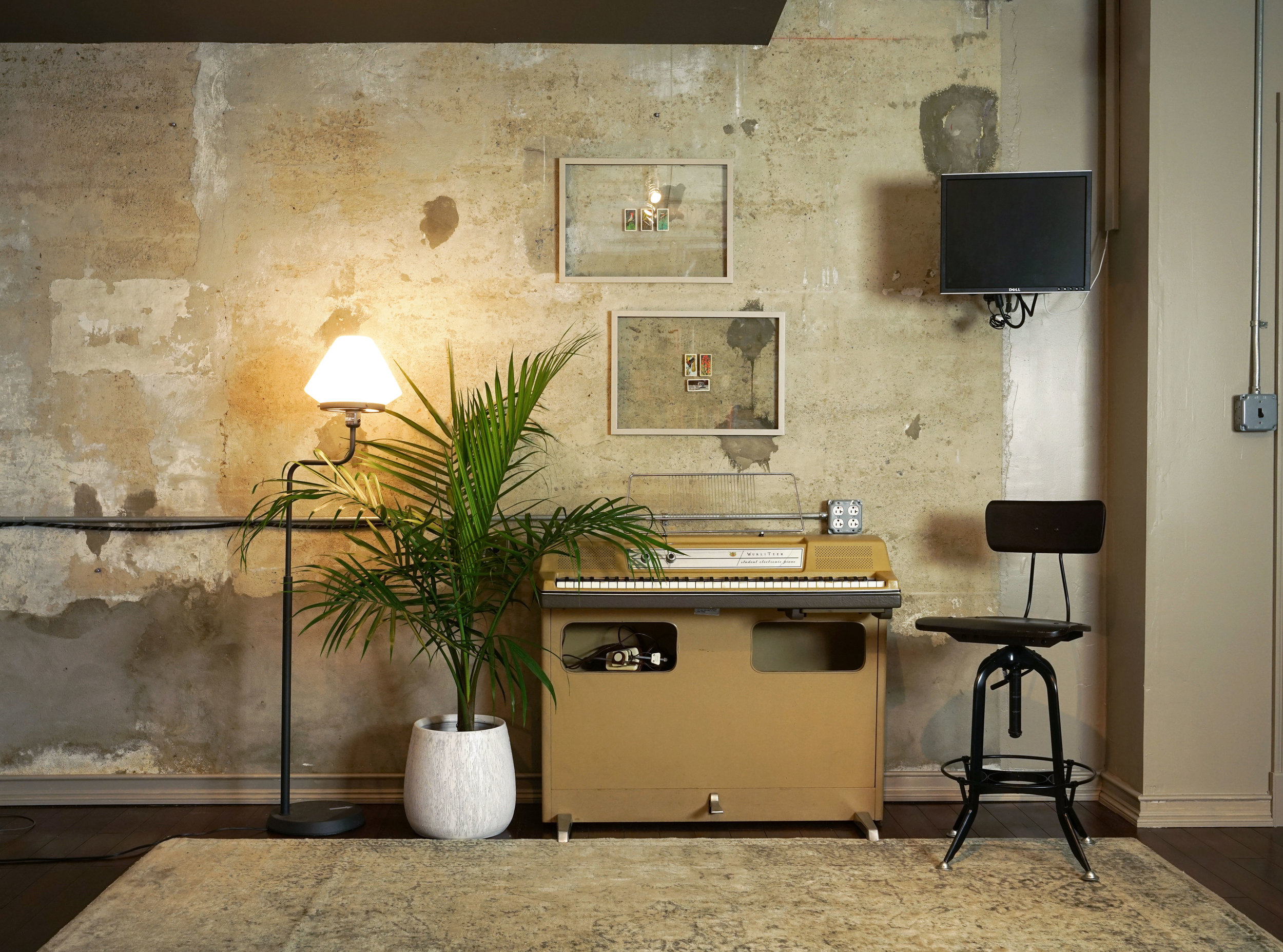 Wurlitzer 206 in a recording studio near a concrete wall