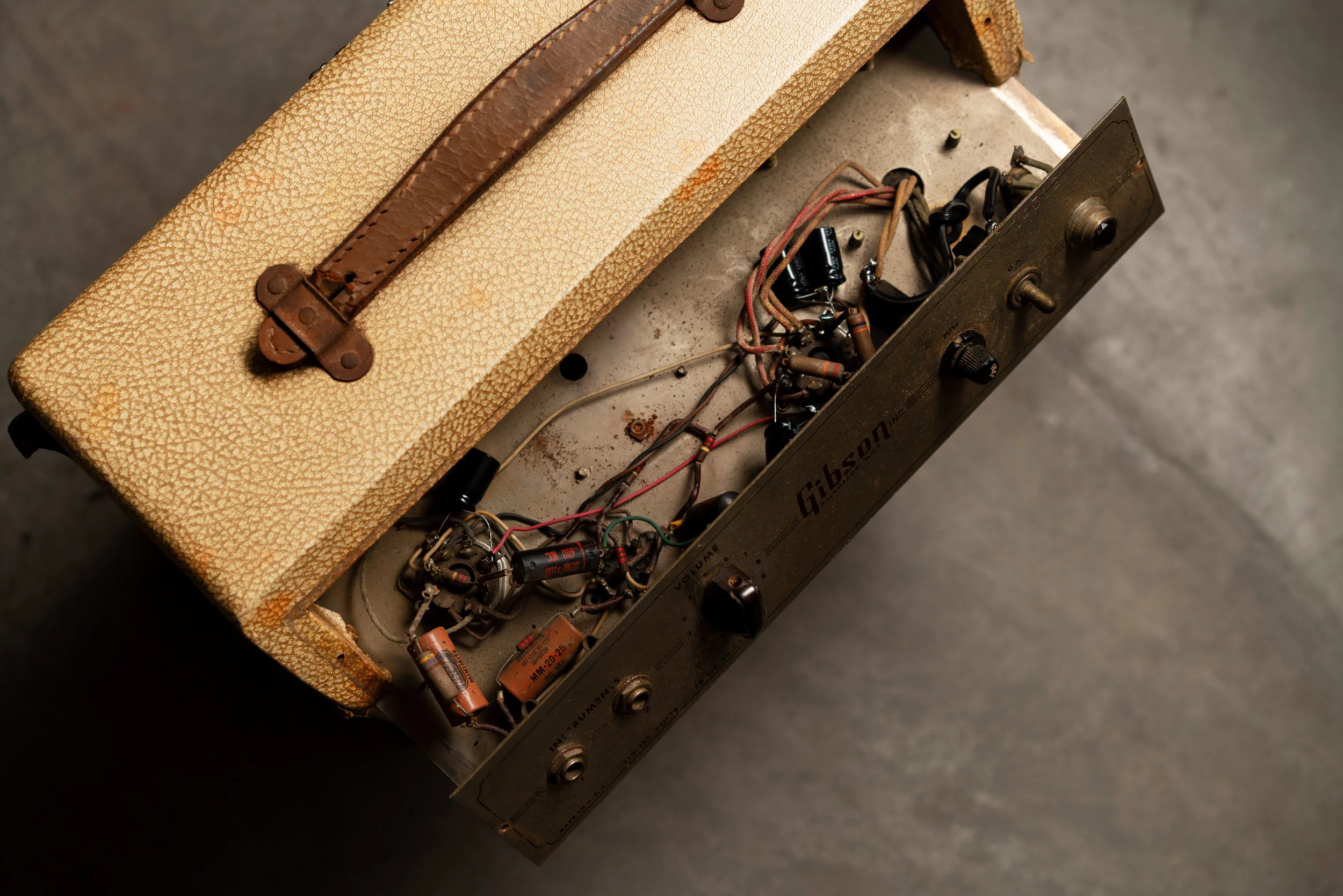 This vintage Gibson GA-5 circuit still has a lot of original parts. At some point, a few of the electrolytics were replaced.