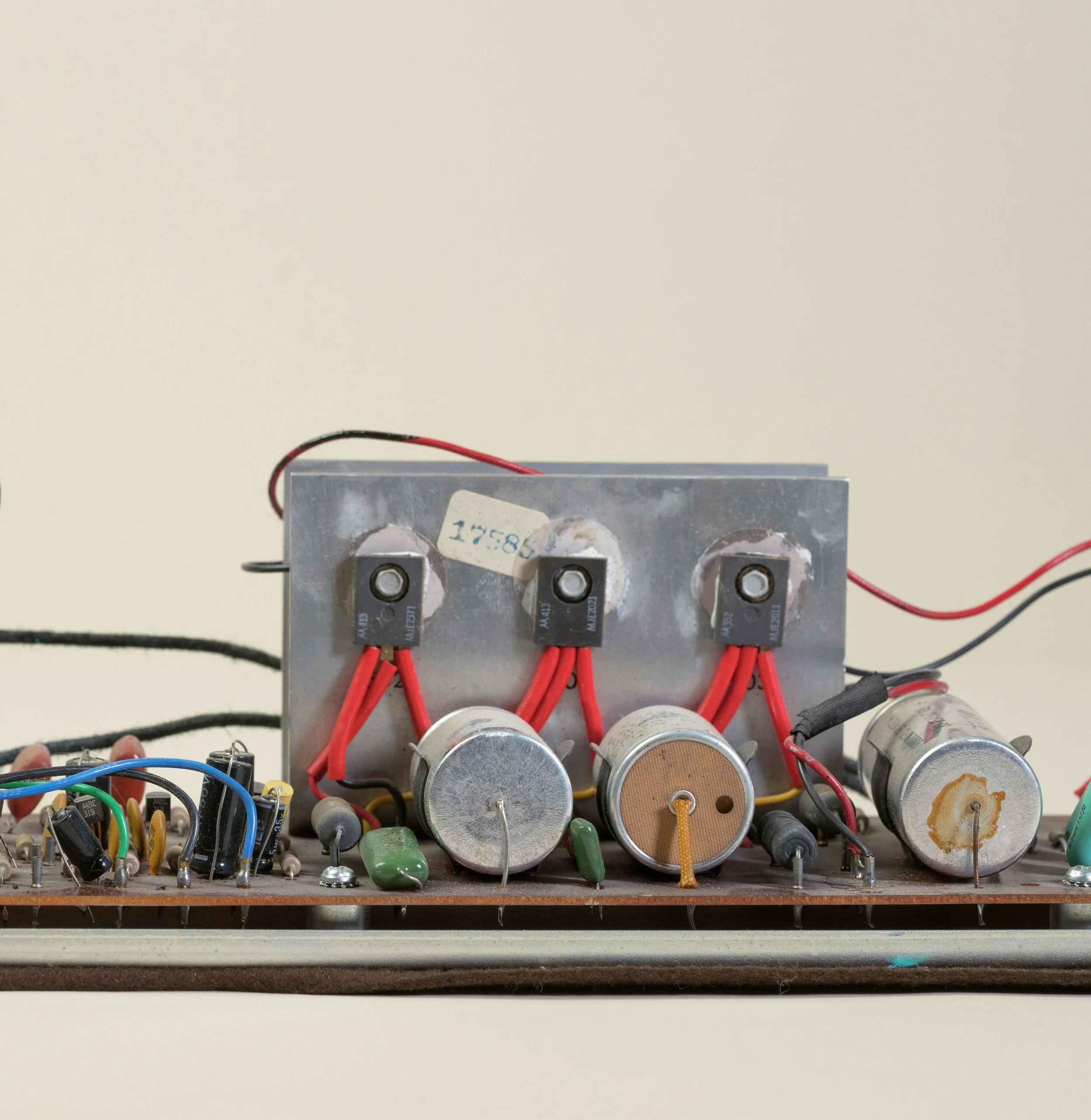 The Wurlitzer 200 filter capacitor on the right is physically leaking its electrolyte. This means that it should definitely be replaced.