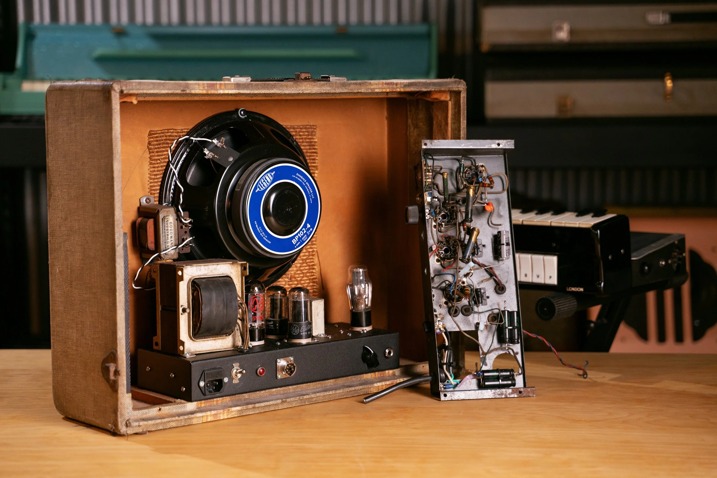 A rebuilt Selmer Clavioline amplifier in its original cabinet with a new speaker. The old amplifier chassis is pictured next to it.