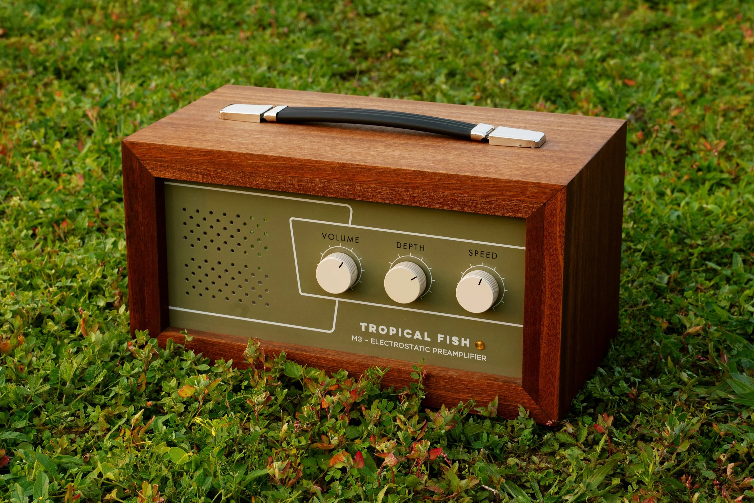 Tropical Fish M3 preamplifier outdoors in green plants.