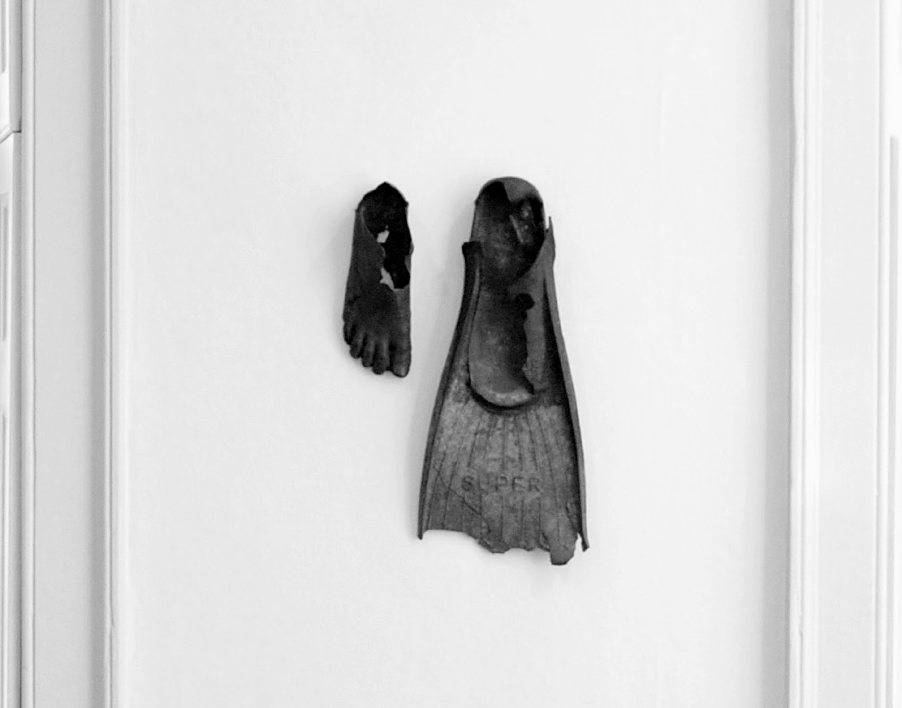 Dorothy Cross - Little Boy Foot and Fin , 2008, Cast bronze and rubber fin, 5 x 41 x 24 cm