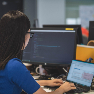 Female Software Developer Writing Code