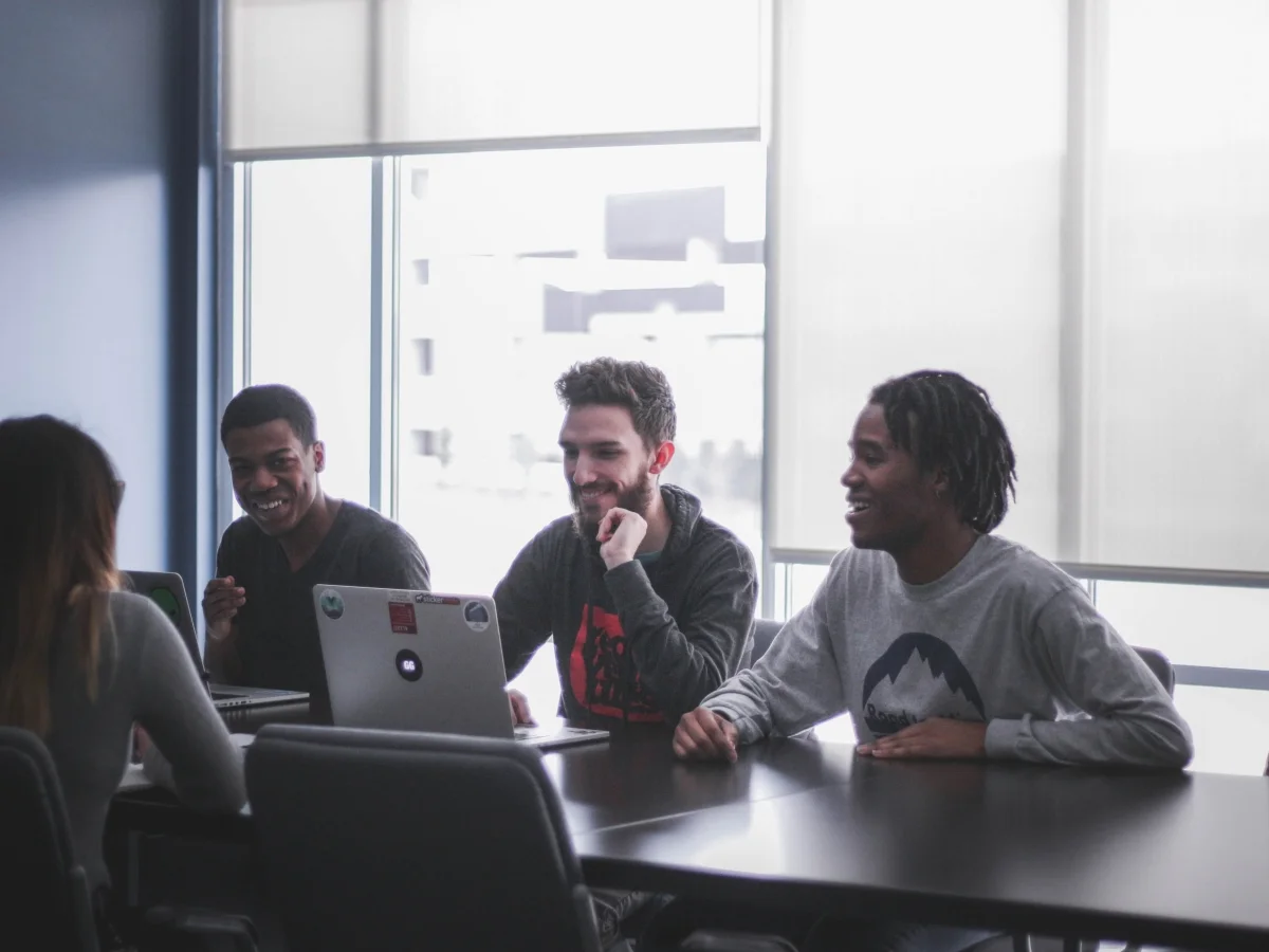 Four Onshore Software Developers Sitting at a Table