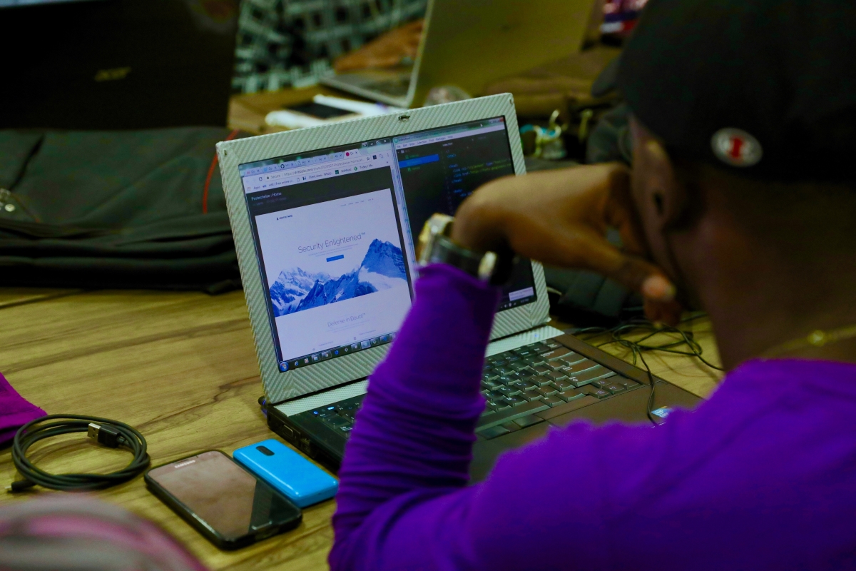Offshore Software Developer Writing Code on a Laptop