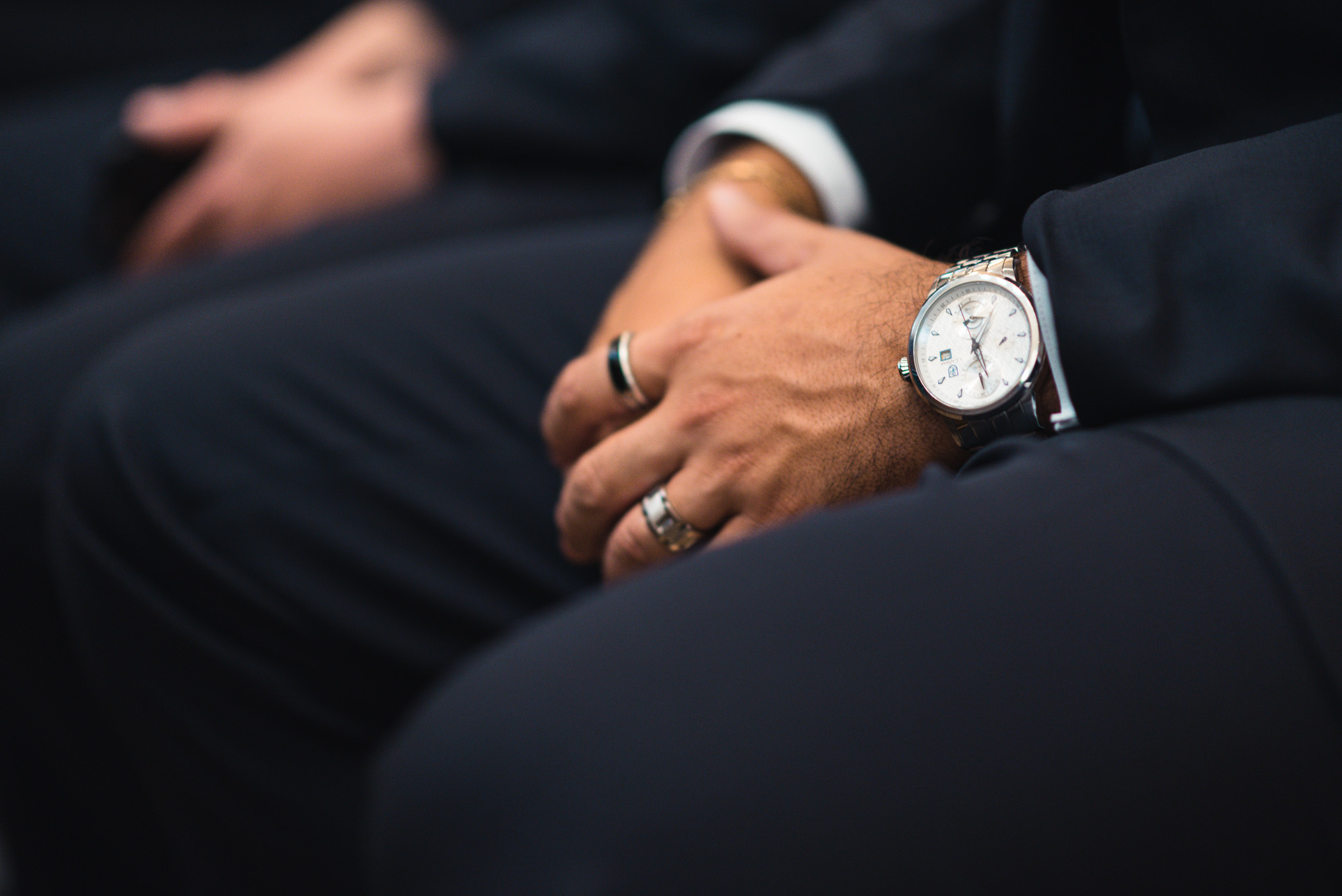 Groomsman hand detail at ceremony