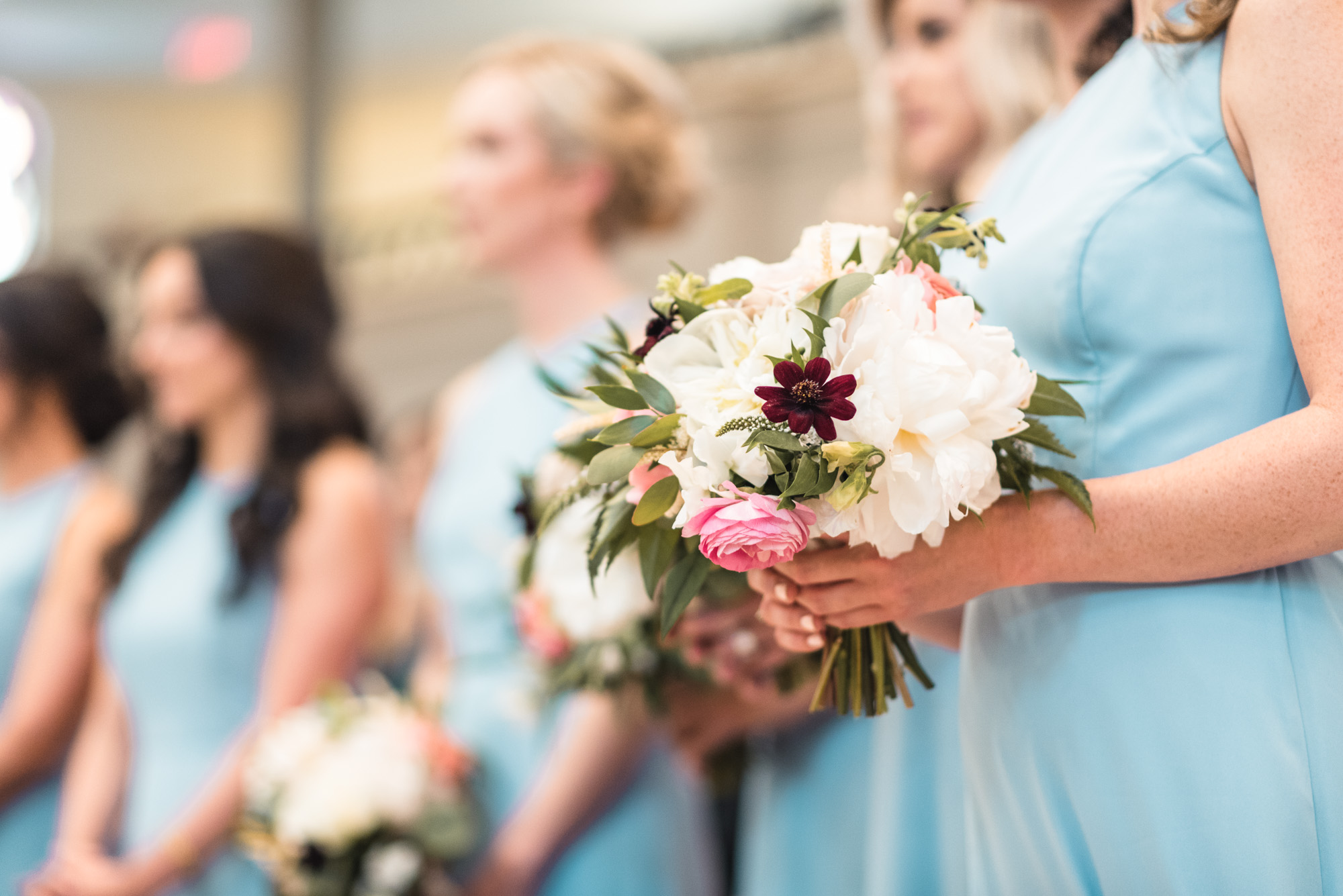 Bridesmaids bouquet at ceremony