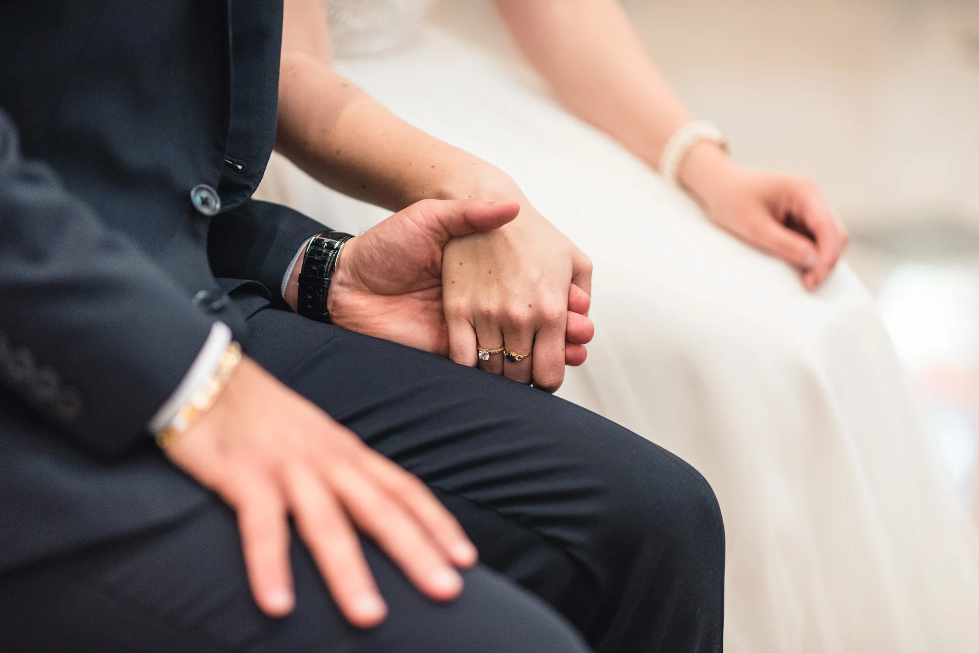 Bride and Groom hold hands at ceremony