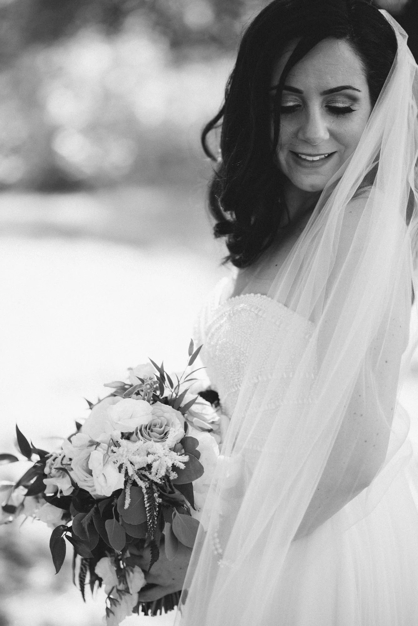 Bride and bouquet at the bark