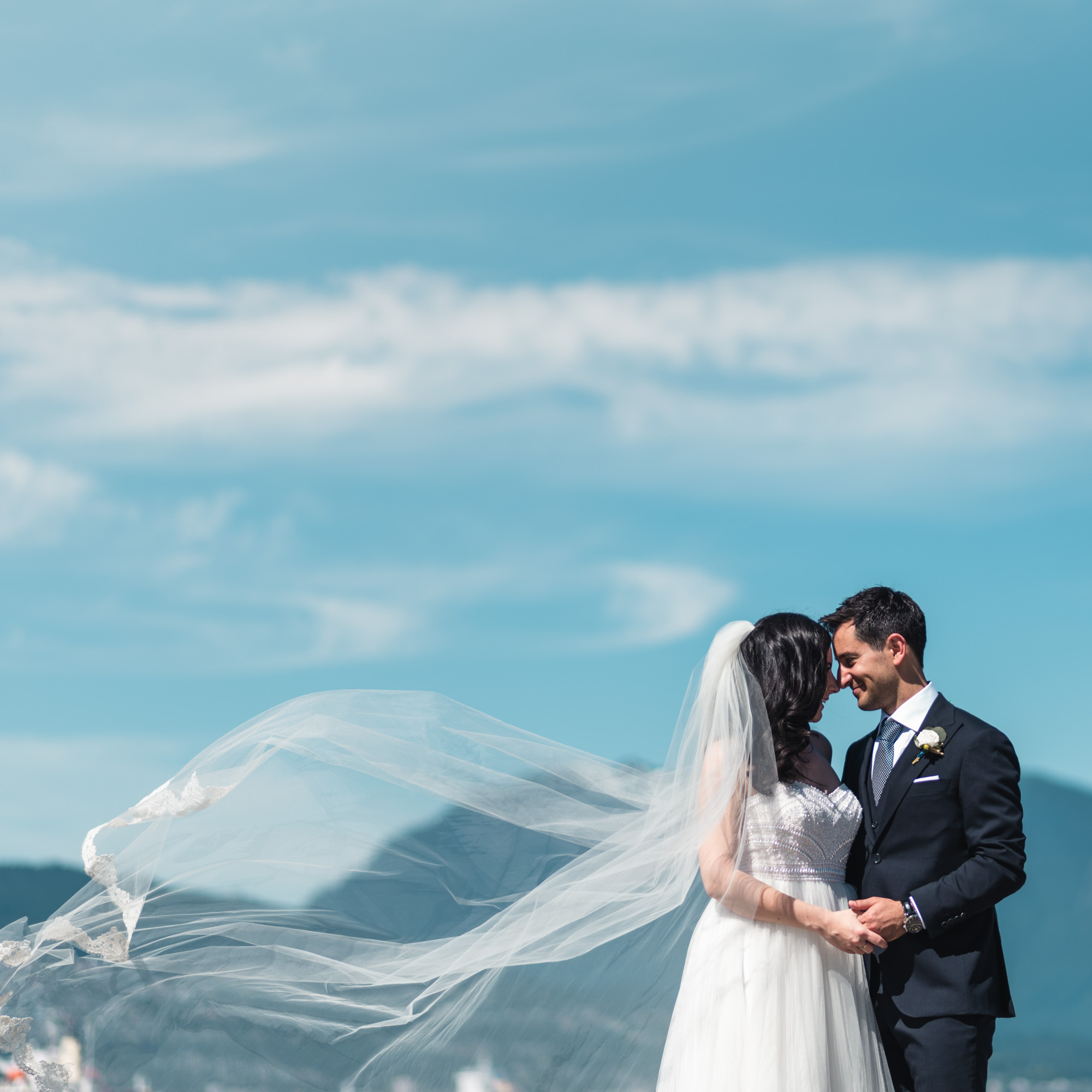 Bride and Groom at the beach with mountains