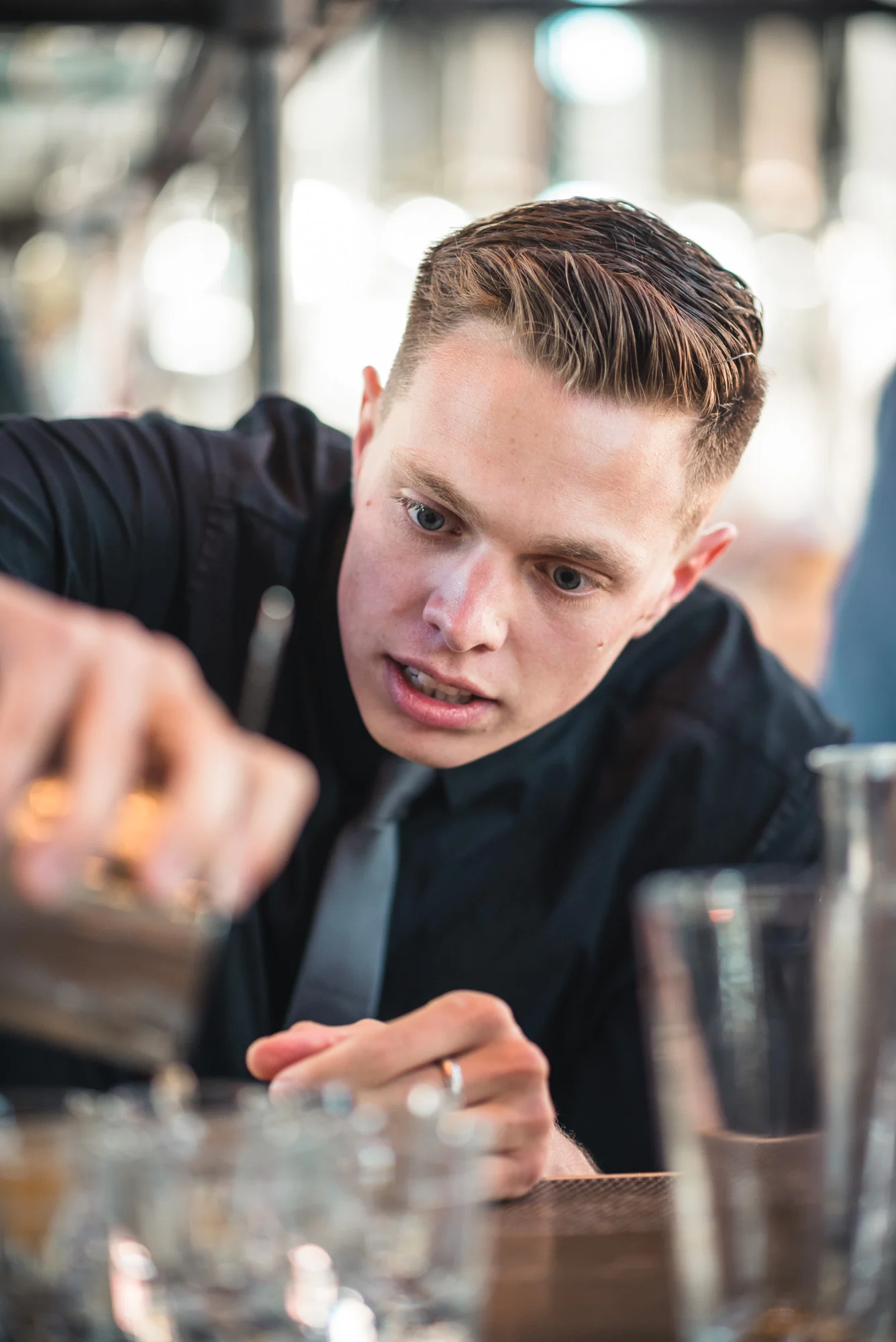 Bartender making shots at the bar