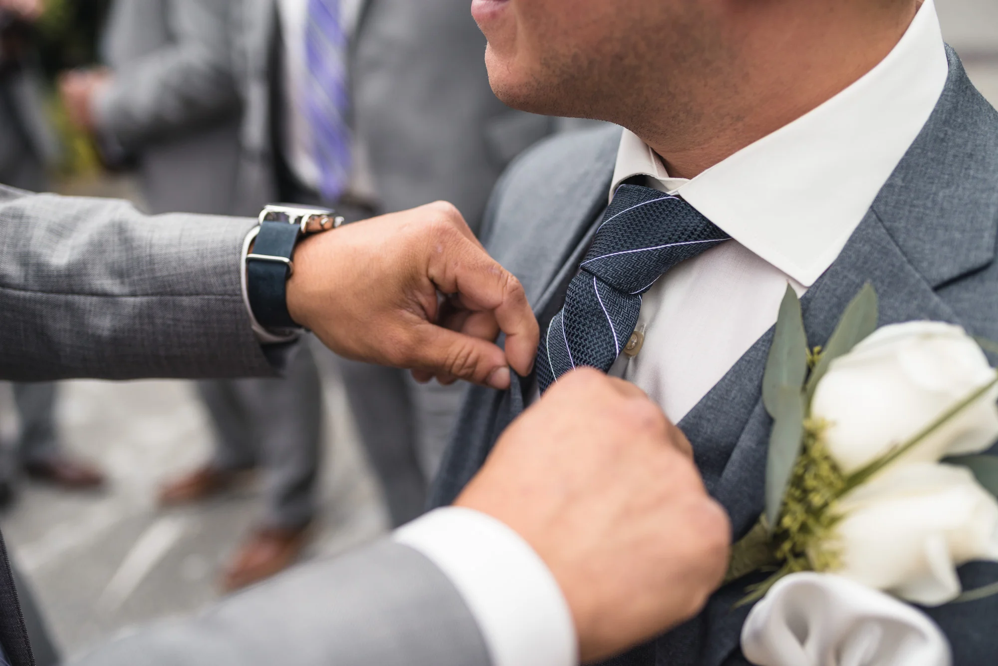 Adjusting the Groom's tie