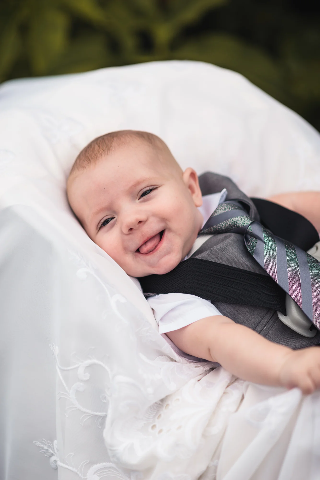 Son of Bride and Groom smiling at ceremony