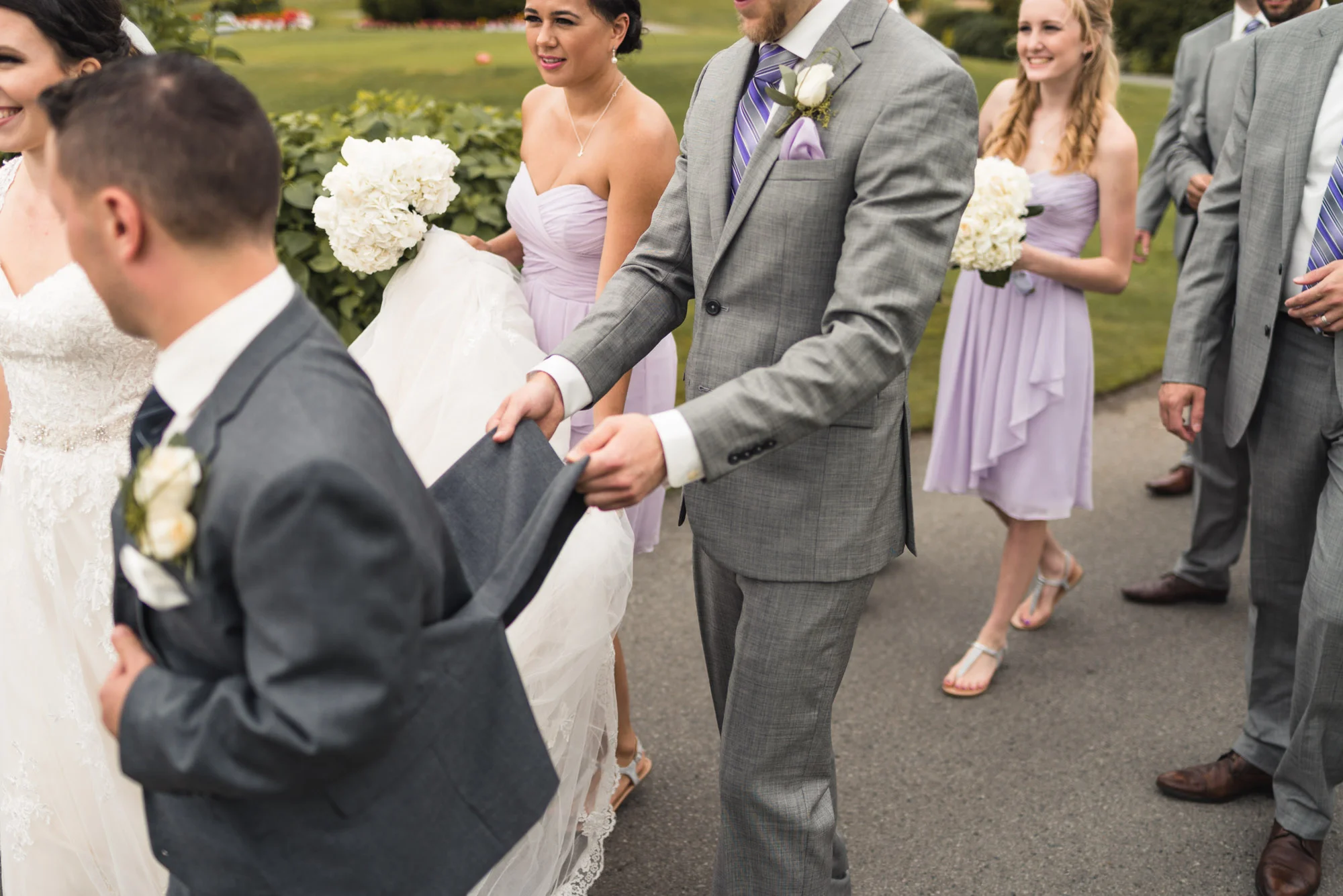 Wedding party walking with Bride and Groom