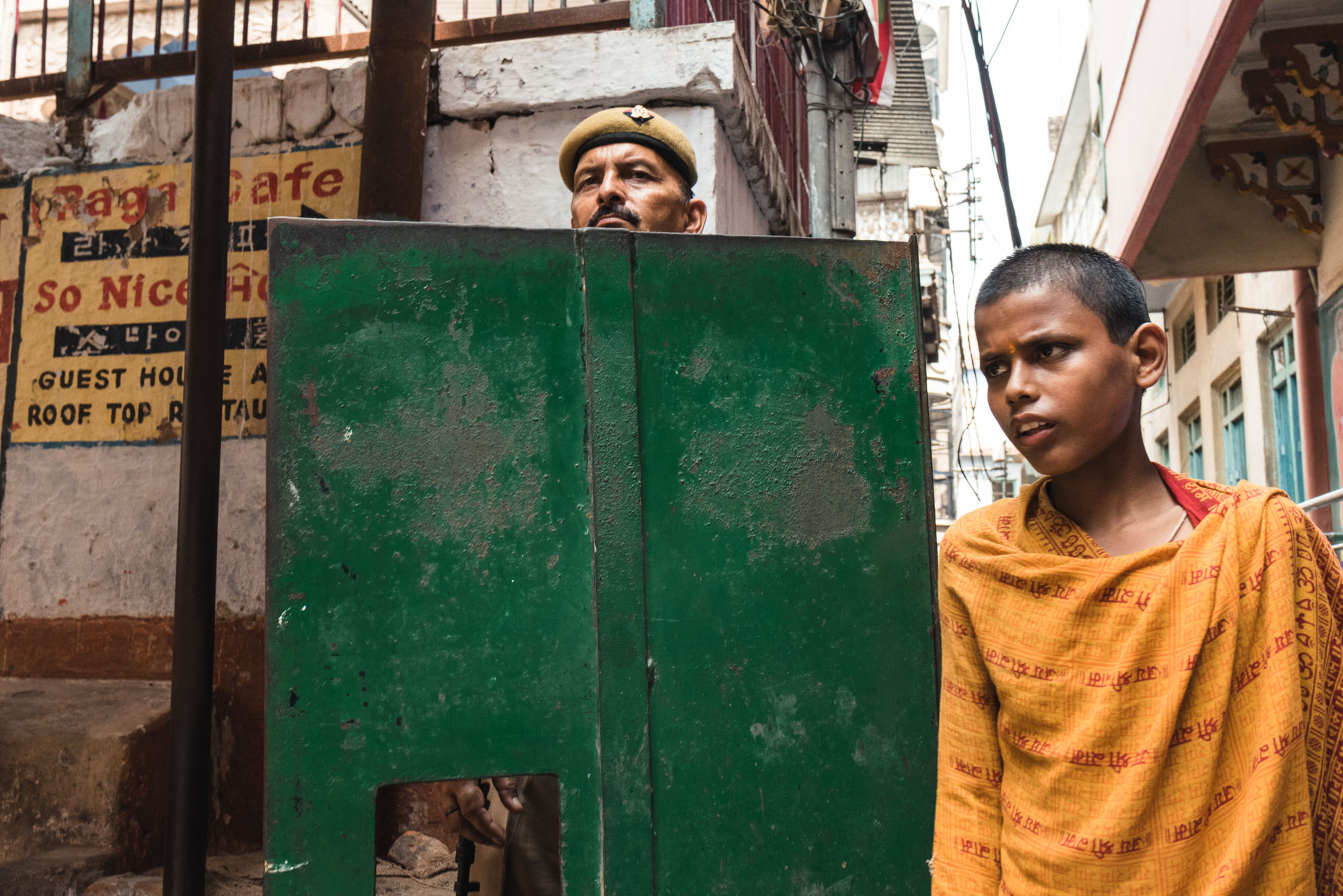 Police officer and boy in Varanasi