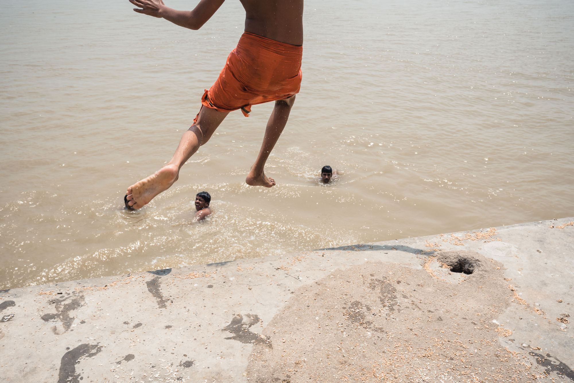 Boys jumping into the Ganges in Varanasi