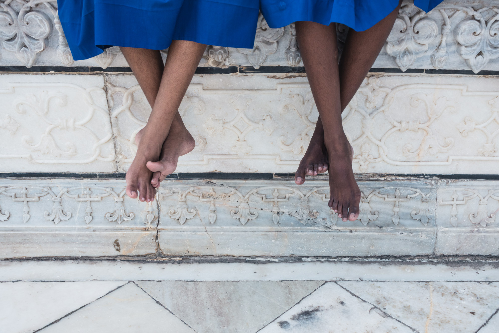 Sitting girl's feet at the Taj Mahal