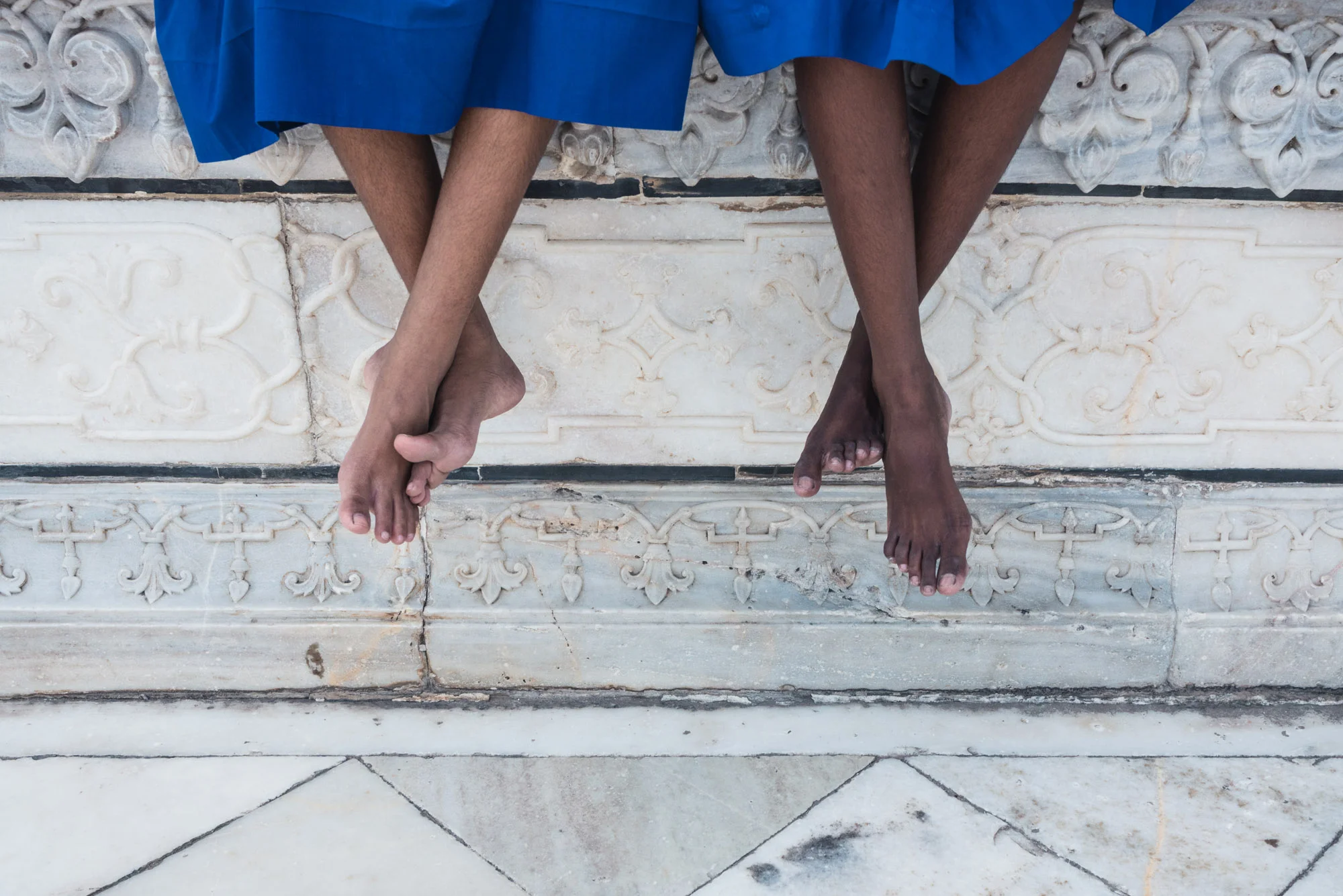Sitting girl's feet at the Taj Mahal