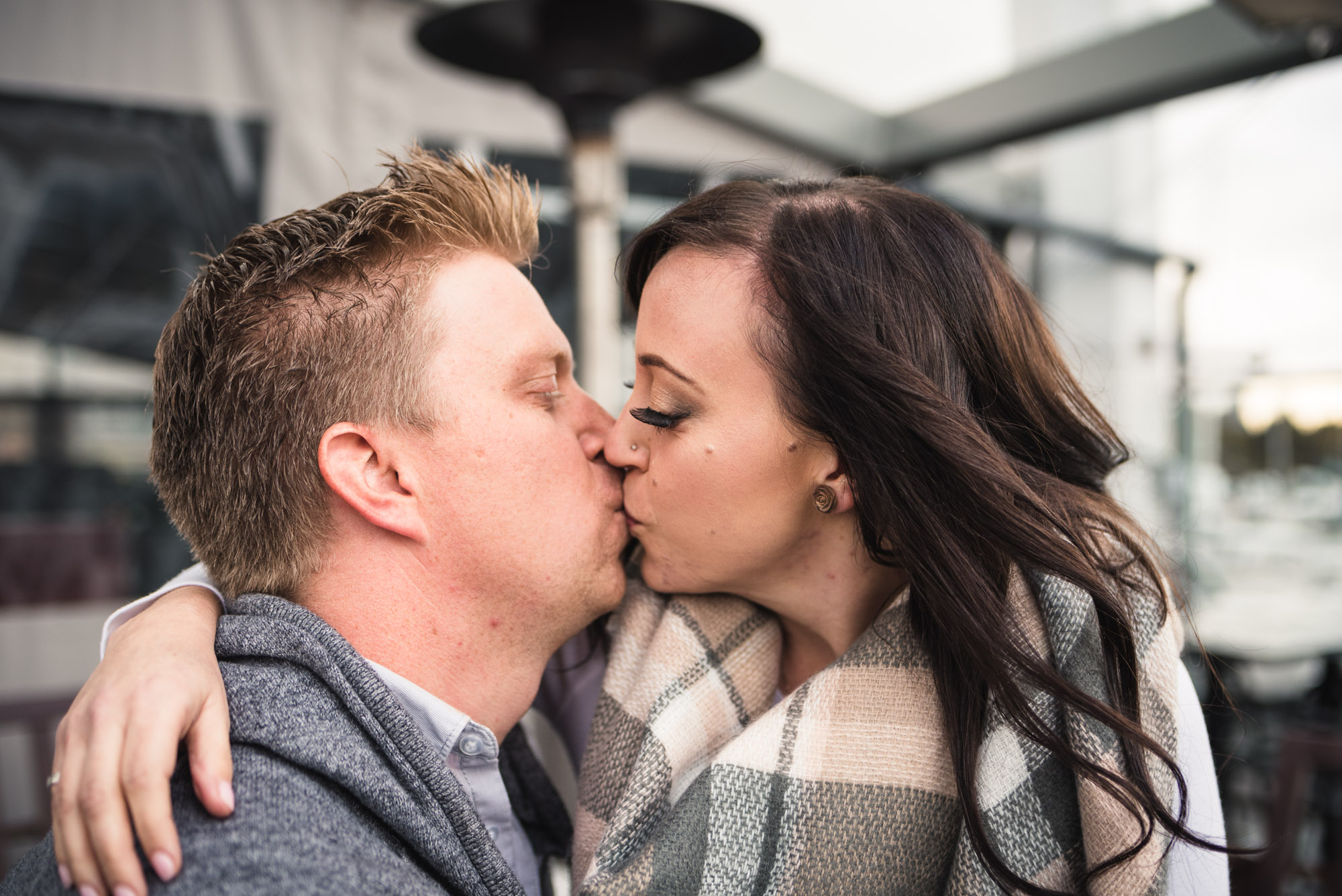 Couple kiss on patio