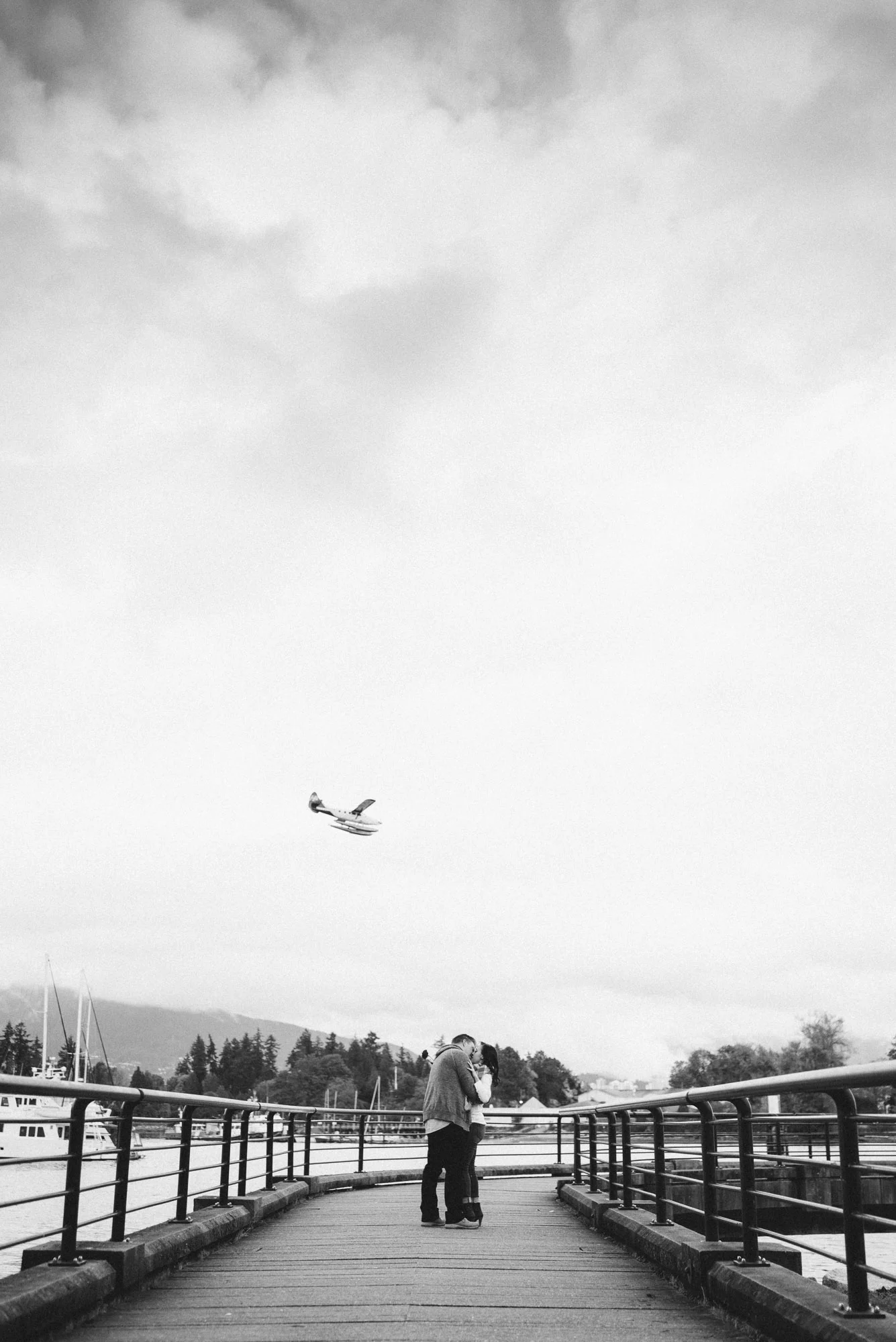 Couple kissing under seaplane
