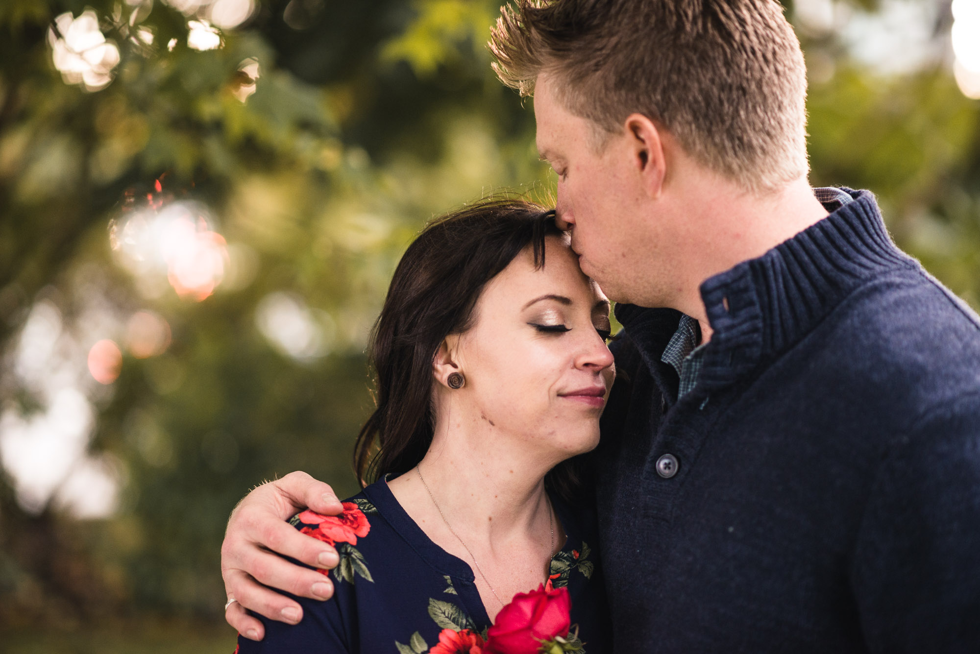 Couples kiss on forehead