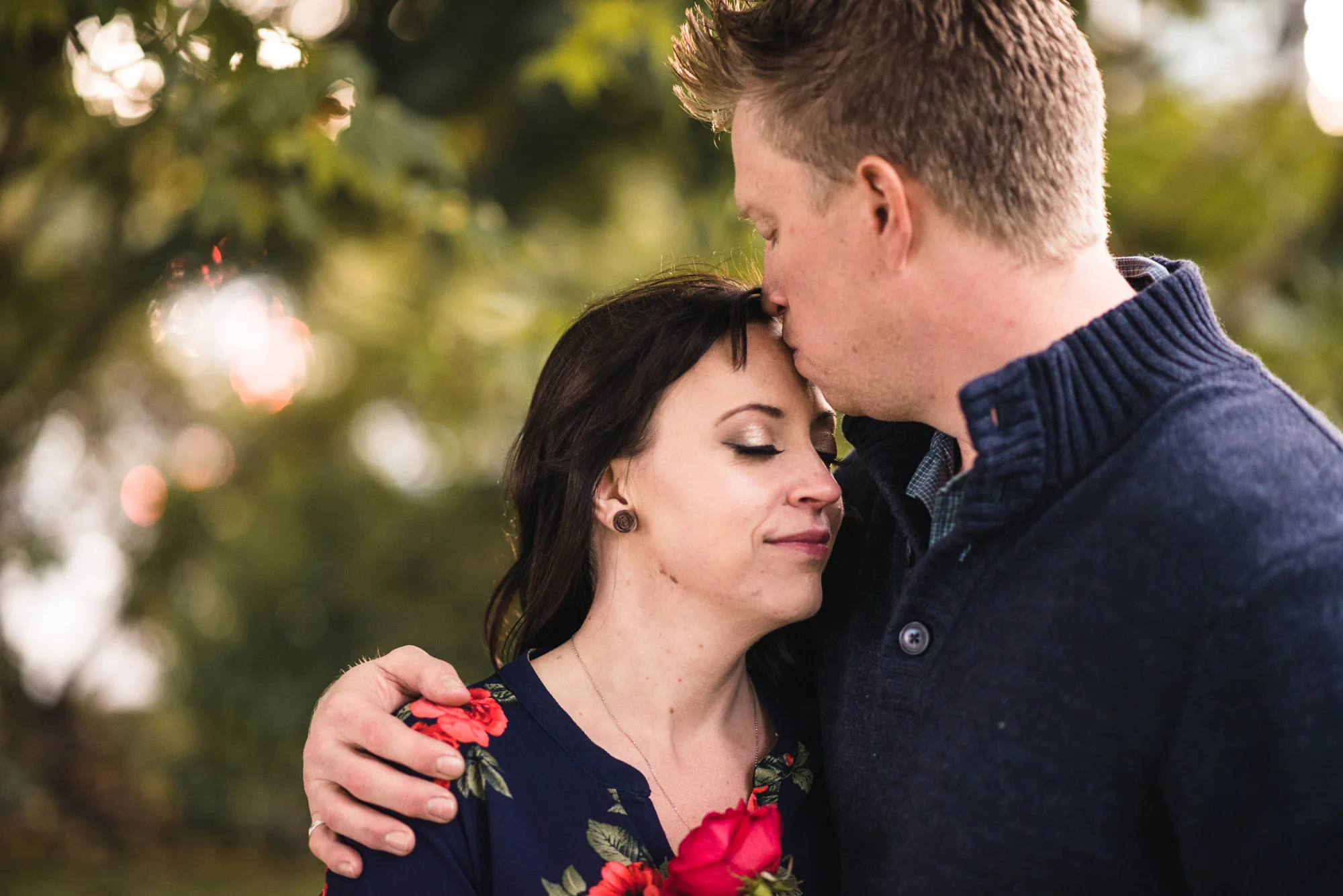 Couples kiss on forehead