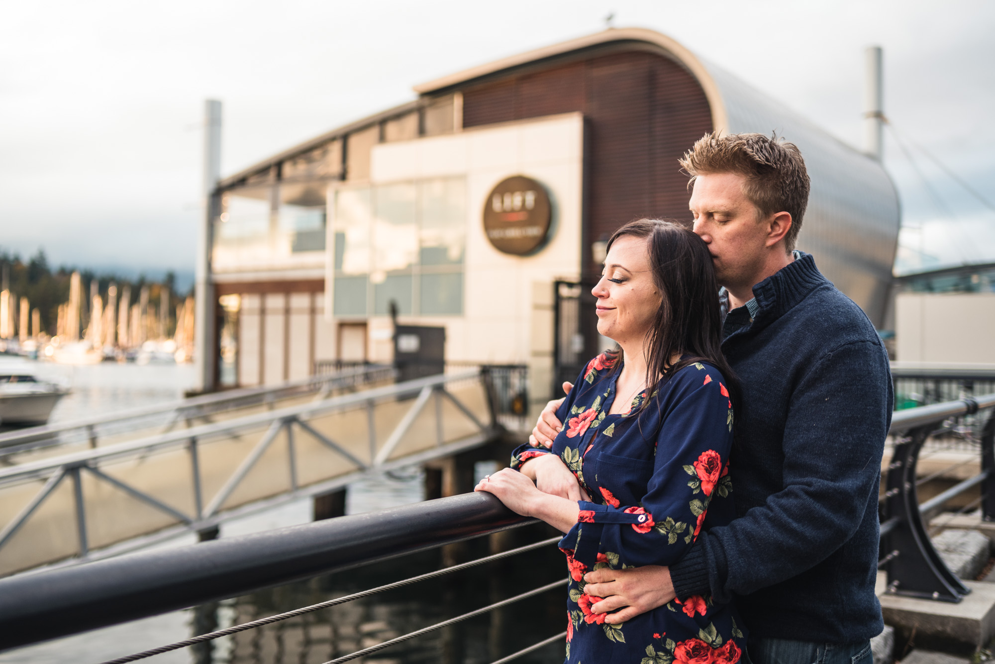 Couple hugs on seawall