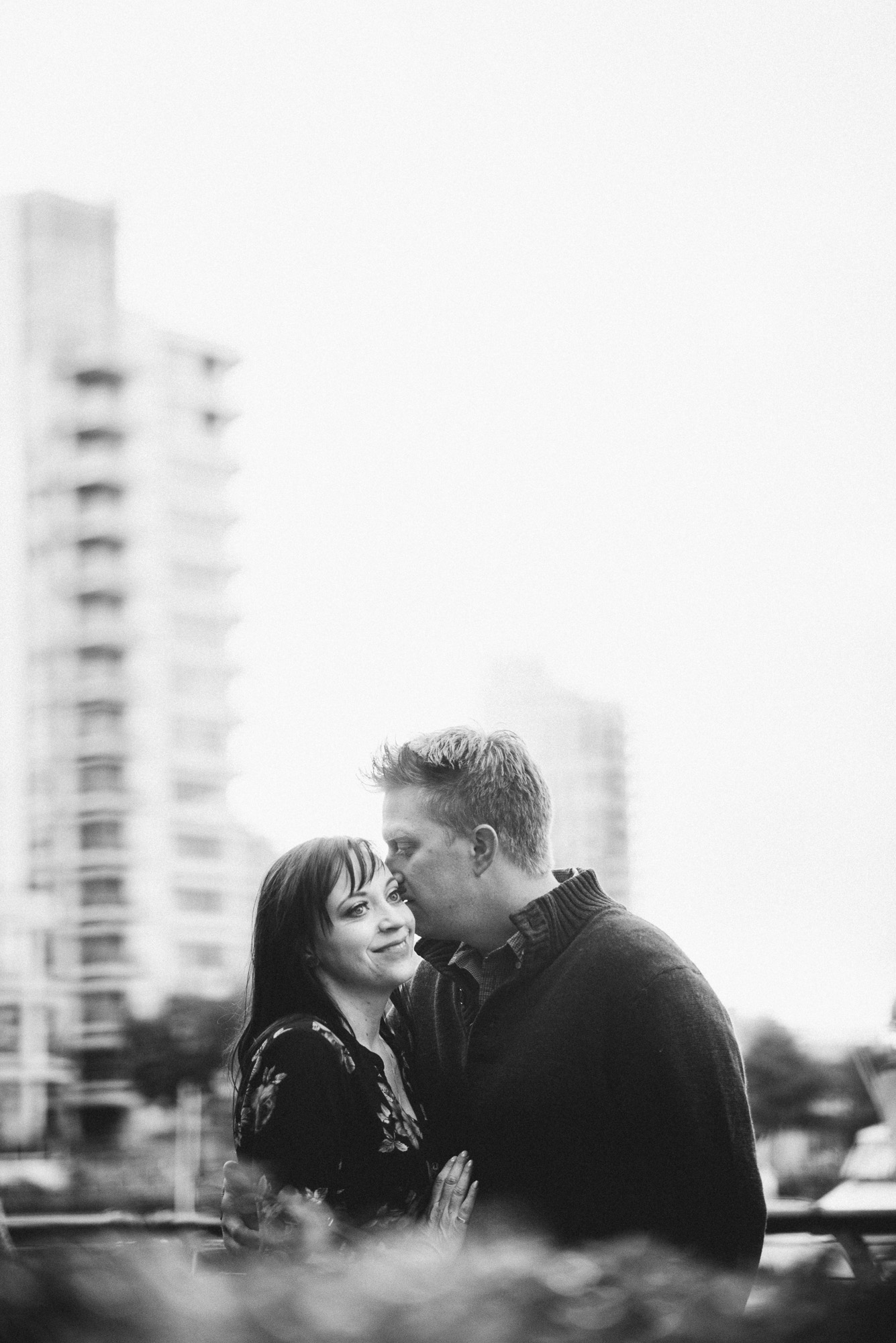 Couple kissing on seawall