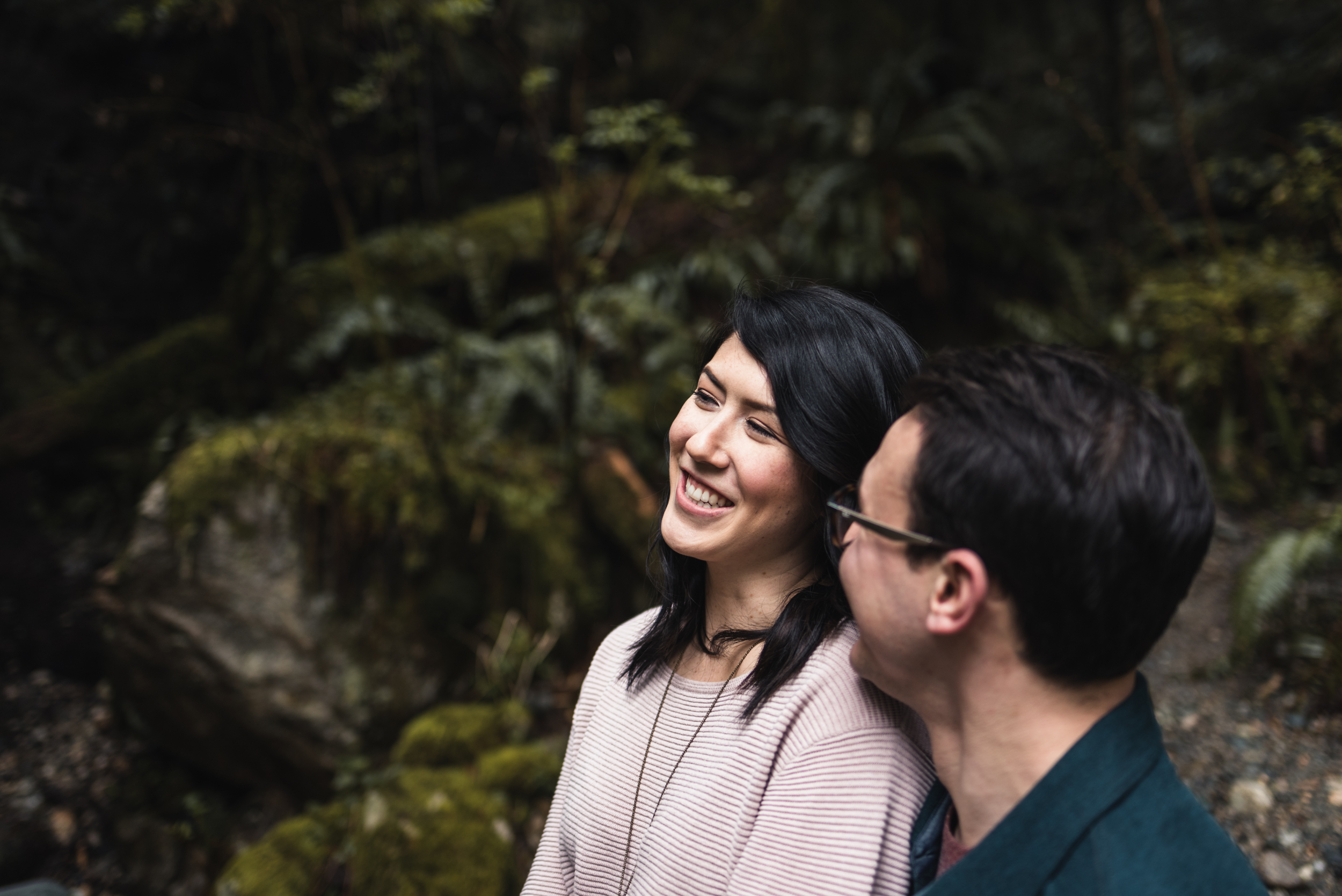 Couple smiling in forest
