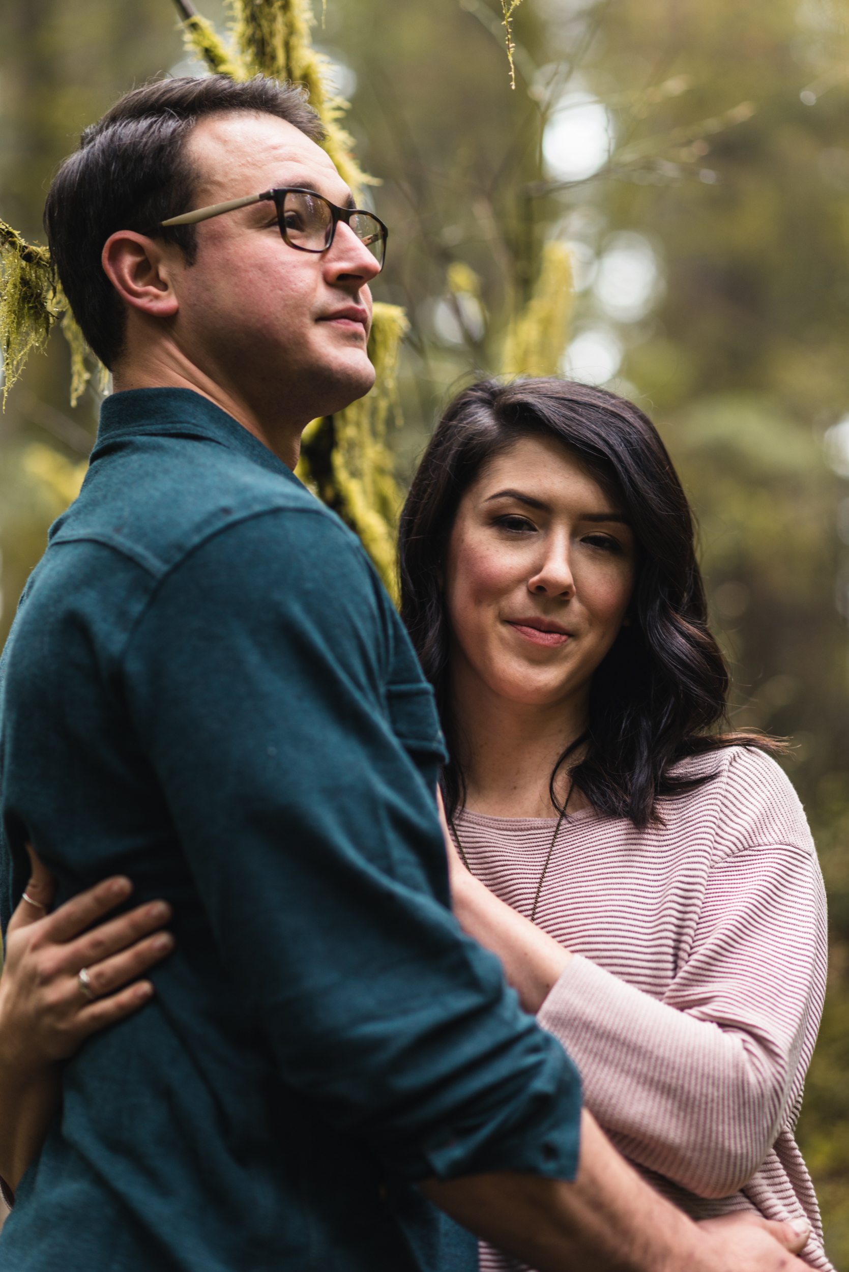 Couple embracing in forest